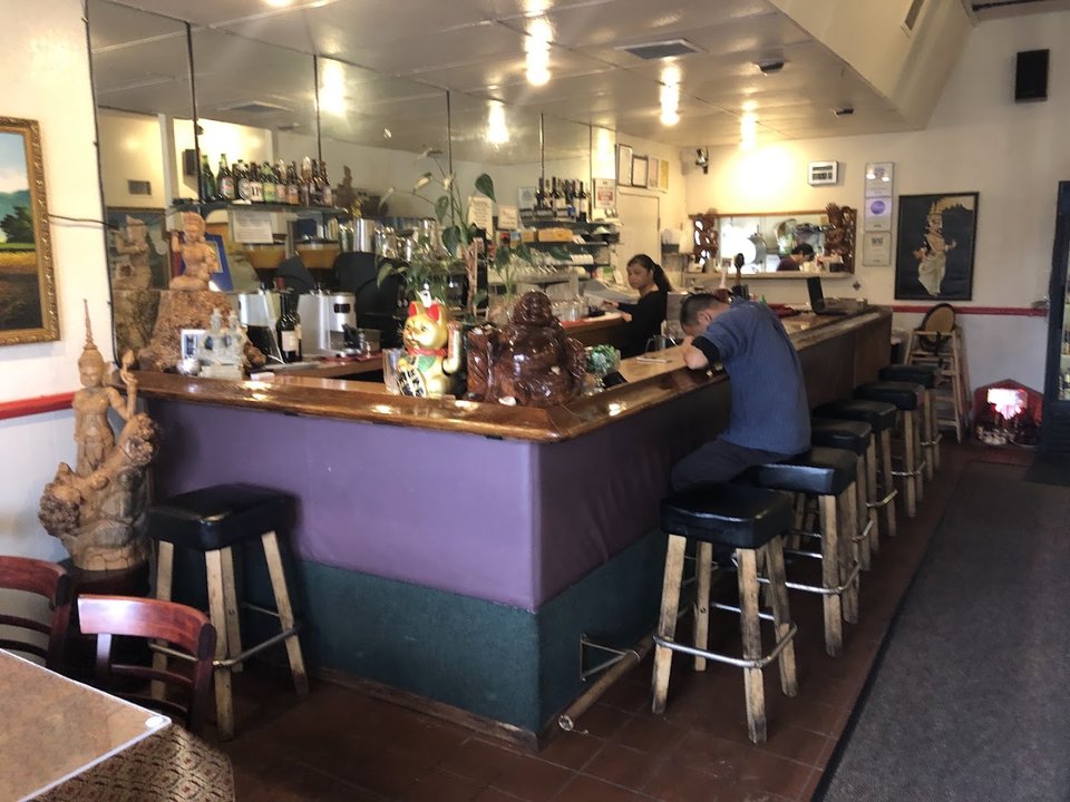 Warm, informal restaurant interior with simple seating.
